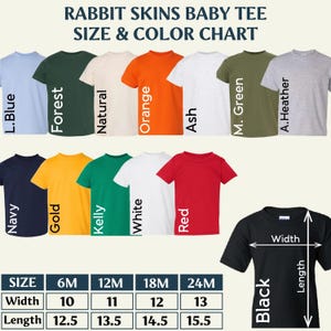 May include: Rabbit Skins baby tee size and color chart featuring twelve short-sleeve t-shirts in various colors including light blue, forest, natural, orange, ash, military green, heather, navy, gold, kelly, white, red, and black with a size table.