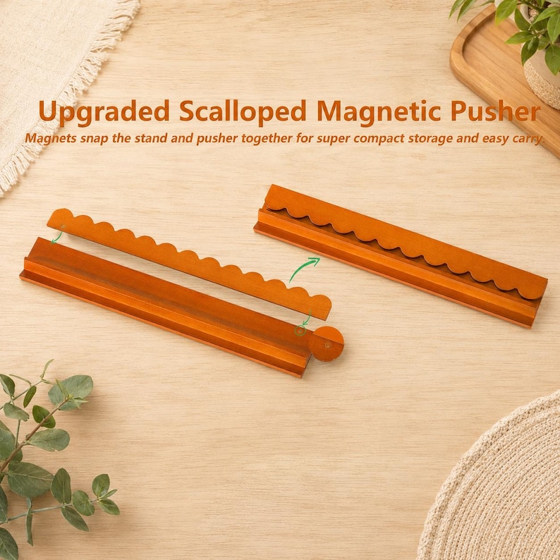 May include: Two brown wooden scalloped magnetic pushers, each featuring a long base and a detachable scalloped edge piece. The text Upgraded Scalloped Magnetic Pusher is visible above the items, along with the phrase Magnets snap the stand and pusher together for super compact storage and easy carry.