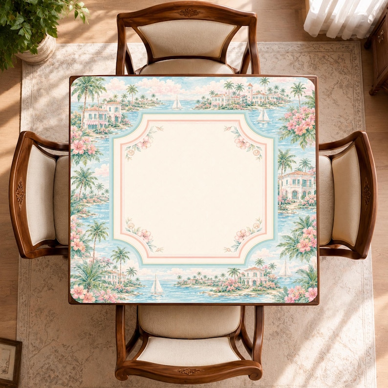 May include: A square table with a light cream center and a decorative border featuring a tropical coastal scene with palm trees, sailboats, villas, and pink flowers. The table is surrounded by four wooden chairs with cream-colored upholstered seats.