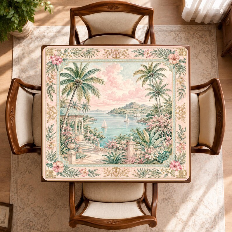 May include: A square wooden table featuring a tabletop with a printed tropical coastal scene. The image depicts palm trees, a calm bay with sailboats, a stone terrace, and lush flowers, framed by a decorative border with floral motifs.