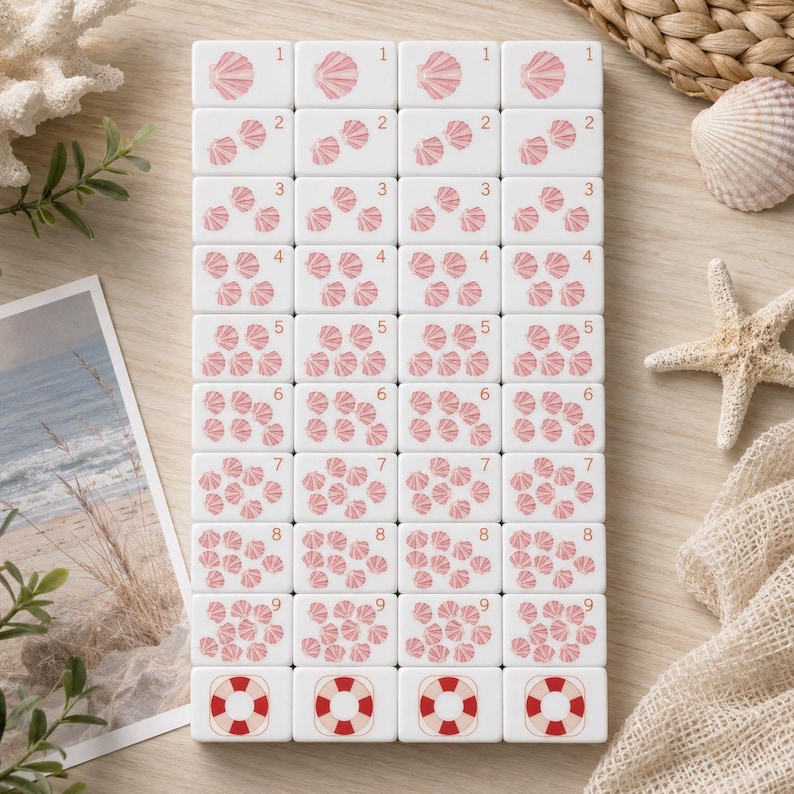 May include: A set of white rectangular tiles arranged in a grid, each featuring pink seashell illustrations corresponding to the numbers one through nine, with a red and white lifebuoy icon on the bottom row of each column.