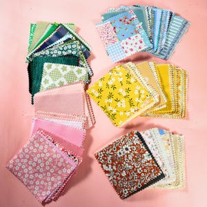 May include: A collection of square fabric swatches with pinked edges, arranged in four distinct stacks. The swatches feature a variety of patterns including floral prints, gingham, stripes, and solid colors in shades of green, yellow, pink, and brown.
