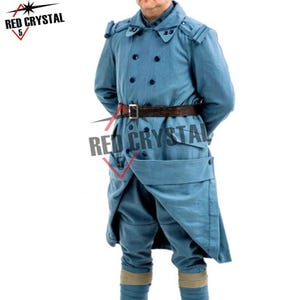May include: A double-breasted light blue wool coat featuring a wide collar, shoulder epaulets, and a dark brown leather belt with a metal buckle. The coat has two rows of dark buttons and a long, structured skirt. Text reads RED CRYSTAL 5.