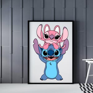 May include: Framed art print featuring the cartoon characters Stitch and Angel. Stitch, a blue alien, is holding Angel, a pink alien, above his head. The artwork is set against a white background within a black frame.