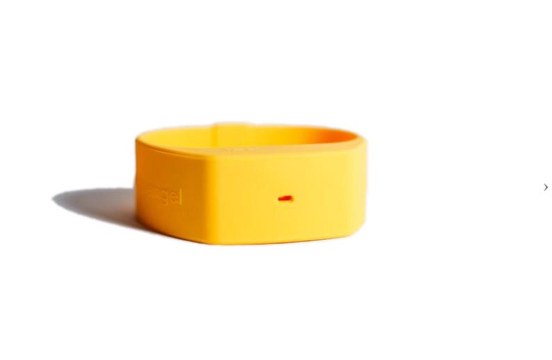 May include: A bright yellow silicone wristband featuring a smooth, matte finish and a small, horizontal rectangular cutout on the front surface. The word 'angel' is embossed in a subtle, matching yellow tone on the side of the flexible band.