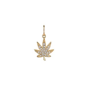 May include: A gold pendant shaped like a seven-pointed leaf, featuring a textured surface and embedded with small, clear, sparkling stones across the front. The pendant includes a small circular jump ring at the top for attachment to a chain.