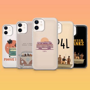 May include: Five clear phone cases featuring Outer Banks themed designs. The cases display illustrations of a vintage van, a sunset, a boat with people, and text including POGUE LIFE, OBX, and OUTER BANKS. Each case has a dual camera lens cutout.