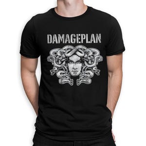 May include: A black short-sleeved t-shirt featuring the white text DAMAGEPLAN above a detailed graphic illustration of a face surrounded by multiple intertwined snakes. The design is centered on the chest of the garment, which has a crew neckline.