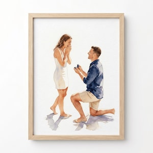 Pode incluir: Uma ilustração em aguarela numa moldura de madeira clara que retrata um pedido de casamento. Uma pessoa está de joelhos, vestindo uma camisa azul-escura e calções bege, segurando uma pequena caixa de anel azul para outra pessoa de vestido branco.