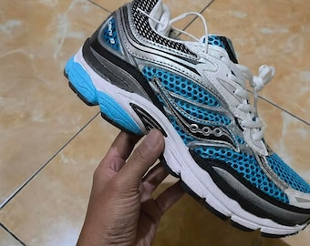 Saucony Omni 9 cyaan hemelsblauw licht, wit zwarte accenten, uniseks hardloopschoenen sneakers