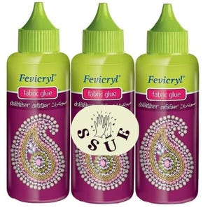 May include: Three bottles of Fevicryl fabric glue with green caps and purple labels. The labels feature a paisley design and the words "fabric glue". One bottle has a white sticker with a hand symbol and the letters "S U F".