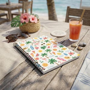 May include: A spiral-bound journal featuring a repeating pattern of pink flamingos, palm trees, hibiscus flowers, orange slices, surfboards, and suns on a white background. The word Journal is printed in black text on the front cover.