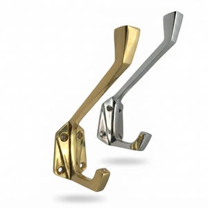 May include: Two wall-mounted coat hooks, one in a polished gold-tone brass finish and one in a polished silver-tone chrome finish. Each hook features a triangular base plate with three screw holes and a long, angled arm with a curved end.