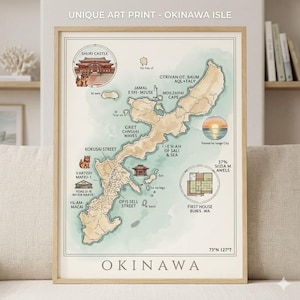 May include: A framed art print featuring a map of Okinawa Isle with a beige landmass and light blue water. It includes illustrations of Shuri Castle, a sunset, and a floor plan, with text labels like Kokusai Street and Okinawa at the bottom.