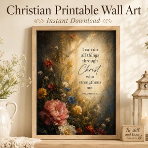 Könnte beinhalten: Ein gerahmter Wandkunstdruck mit einem lebendigen Blumenarrangement aus roten, gelben und weißen Blüten. Der Text lautet: I can do all things through Christ who strengthens me. Philippians 4:13. Das Kunstwerk ist in einem hellen Holzrahmen.