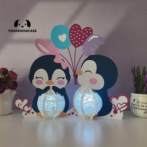 Caja de sombras SVG de San Valentín con forma de pareja de pingüinos y linterna para proyectos de bricolaje de Cricut, linterna perfecta para decoraciones del día de San Valentín.