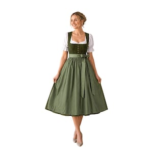 May include: A dirndl dress featuring a dark olive green bodice with a row of small buttons, a white blouse with short puffed sleeves, and a matching olive green skirt with a tied waist apron. The dress has a square neckline and a full skirt.