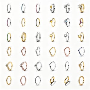 Könnte beinhalten: Eine Sammlung von Ringen in verschiedenen Designs und Farben. Die Ringe umfassen Bänder mit Edelsteinen, floralen Motiven und herzförmigen Details. Einige Ringe sind goldfarben, andere silberfarben, und einige haben Roségold.