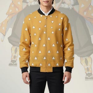 May include: A mustard yellow bomber jacket featuring a repeating pattern of white triangles, a black ribbed collar, black ribbed cuffs, and a full-length front zipper. The jacket is worn over a white collared shirt and black trousers with white sneakers.