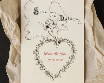 May include: A cream-coloured rectangular card featuring black ink illustrations of a cherub and a heart-shaped floral wreath. The text reads "Save the Date" in black, with "Louise & Eric" and "27.05.2027" printed in red ink.