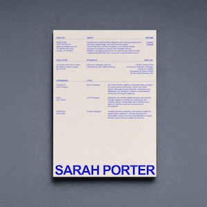 May include: A professional CV document for Sarah Porter printed in blue ink on a light beige background. The layout includes sections for contact, about, education, interests, skillset, and experience, featuring the name SARAH PORTER in large bold blue text.