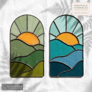 May include: Two stained glass panels with arched tops, depicting a sunrise over rolling hills. One panel features green hues, the other blues and teals. The sun is a bright orange in both. The panels are framed in dark metal. The text "PERSONAL & COMMERCIAL LICENSE INCLUDED" is visible.