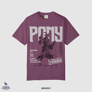 May include: A berry-colored short-sleeve t-shirt featuring the word PONY in large white letters. Below, a graphic shows a goat-headed figure in robes. Text includes ITALY, CAPRID, PARTY LEADER, RANGED SPELLCASTER, and DUNGEON CRAWLER 72223.