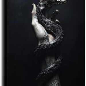 May include: A monochrome canvas print showing a snake wrapped around an arm. The snake's scales are detailed, and the arm is adorned with tattoos. The background is a dark, atmospheric tone.