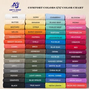 A Comfort Colors 1717 color chart displaying folded t-shirts in various colors with corresponding color names.