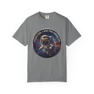 A grey crewneck t-shirt featuring the circular space pug graphic in the center.
