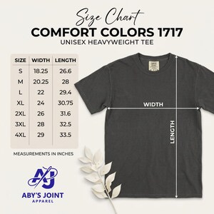 A size chart for the Comfort Colors 1717 unisex heavyweight tee with width and length measurements in inches next to a dark t-shirt.
