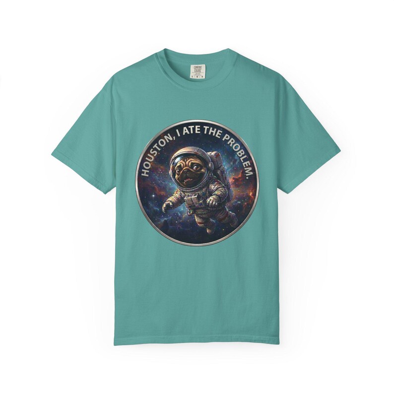 A teal crewneck t-shirt featuring the circular space pug graphic in the center.