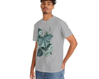 May include: A heather grey short-sleeved t-shirt featuring a central graphic print of a large, pale green moth with detailed wings, surrounded by dark green leaves and white morning glory flowers in a botanical illustration style.