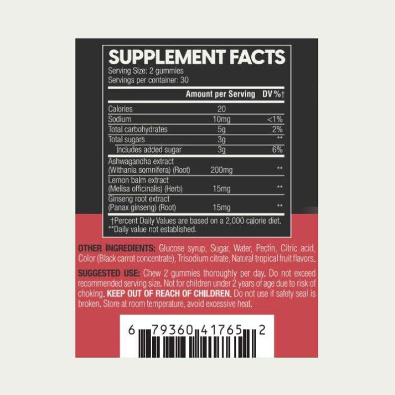 May include: A supplement facts label with a black background and red lower section. It lists serving size, calories, sodium, carbohydrates, sugars, and ingredients including ashwagandha, lemon balm, and ginseng. Includes a barcode at the bottom.