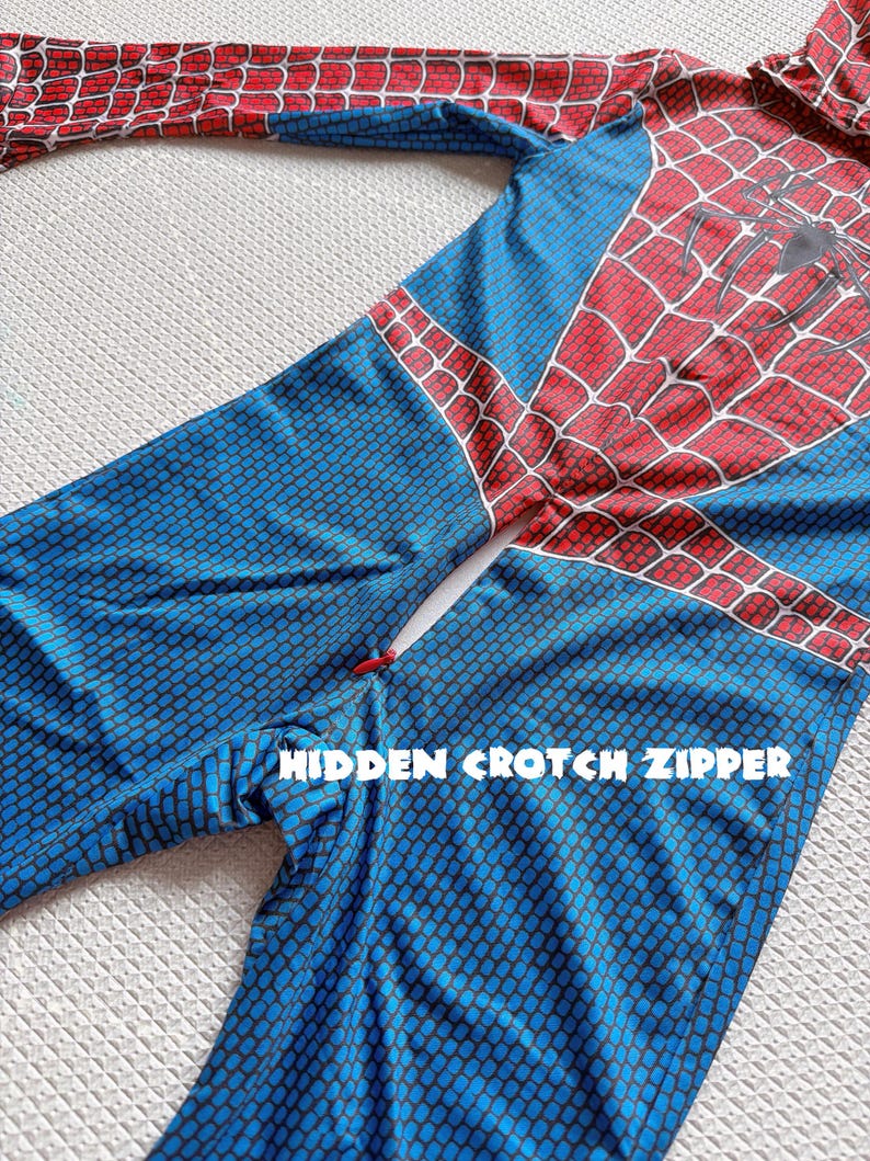 May include: A blue and red Spider-Man costume with a hidden crotch zipper. The costume features a red spiderweb design on the chest and arms, with a black spider emblem. The legs are blue with a textured pattern.
