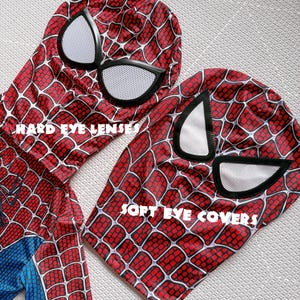 May include: Two Spider-Man masks with red and black web patterns. One mask has "HARD EYE LENSES" printed on it, and the other has "SOFT EYE COVERS" printed on it. The masks have white eye coverings.