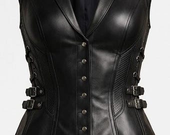 May include: A black sleeveless vest featuring a notched lapel, a front button closure with five metallic buttons, and side panels with a textured diamond pattern. The garment includes adjustable side straps with buckles and metal eyelets.