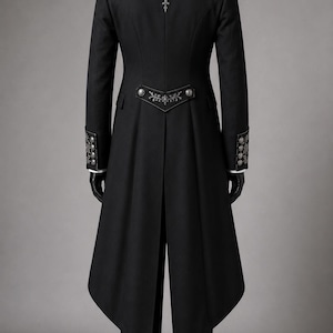 Royal Black Gothic Long Coat Set featuring a Victorian embroidered tailcoat suit with intricate silver floral embroidery on the lapels and cuffs. Elegant aristocrat wedding outfit includes a matching waistcoat, formal trousers, and classic cravat, creating a sophisticated gothic wedding coat look. This cotton trench coat-inspired design is ideal for Victorian events, Gothic weddings, masquerade balls, formal occasions, steampunk gatherings, and aristocratic cosplay.