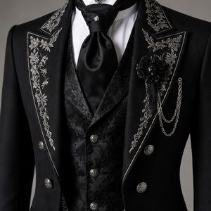 Men's Royal Black Gothic Long Coat Set styled as a Victorian embroidered tailcoat suit with detailed silver embellishments and luxurious formal tailoring. This aristocrat wedding outfit combines vintage elegance with Gothic fashion, making it a perfect gothic wedding coat for ceremonies, receptions, theatrical performances, and costume events. Long cotton trench coat silhouette adds dramatic movement and timeless Victorian charm.