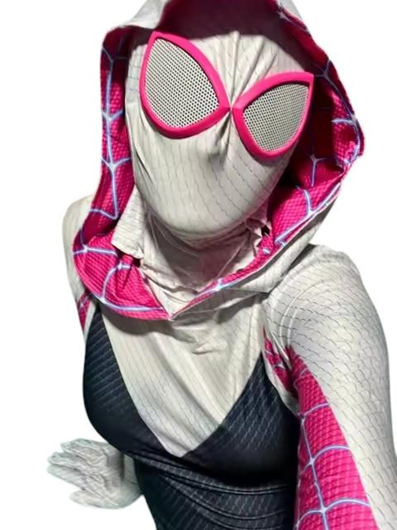 May include: A white and black superhero costume with a hood and pink accents. The costume features a spiderweb pattern and pink-rimmed eye coverings. The costume is made of a stretchy material.