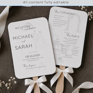 Könnte beinhalten: Zwei weiße Hochzeitsfächer mit abgerundeten Ecken und Holzgriffen, die mit weißen Satinbändern gebunden sind. Die Vorderseite zeigt den Text WELCOME to our WEDDING, MICHAEL and SARAH, 08.24.2026, und THE EVENT CORNER, 13 EAST AVE, MANHATTAN, NY.