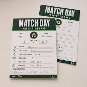 May include: Two rectangular Match Day Prediction Cards with dark green headers and white backgrounds. The cards feature fields for team names, final scores, winner, first scorer, player of the match, total goals, extra time, penalties, and bold prediction.