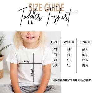May include: A size guide for a toddler t-shirt featuring a table with sizes 2T, 3T, 4T, and 5/6T. The chart lists width and length measurements in inches. A diagram on a white t-shirt illustrates how to measure width and length for accuracy.