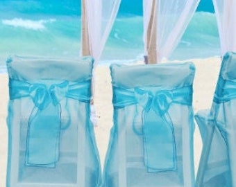 Sheer Turquoise chair cover with matching bow perfect for beach theme, or Special Event, wedding, birthday, table decor, centerpiece, luxury