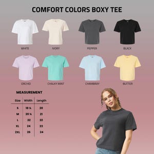 May include: A display of Comfort Colors Boxy Tees in various colors: white, ivory, pepper, black, orchid, chalky mint, chambray, and butter. Measurements are provided for sizes S to 2XL, with widths from 18 1/4 to 26 inches and lengths from 20 to 24 inches.