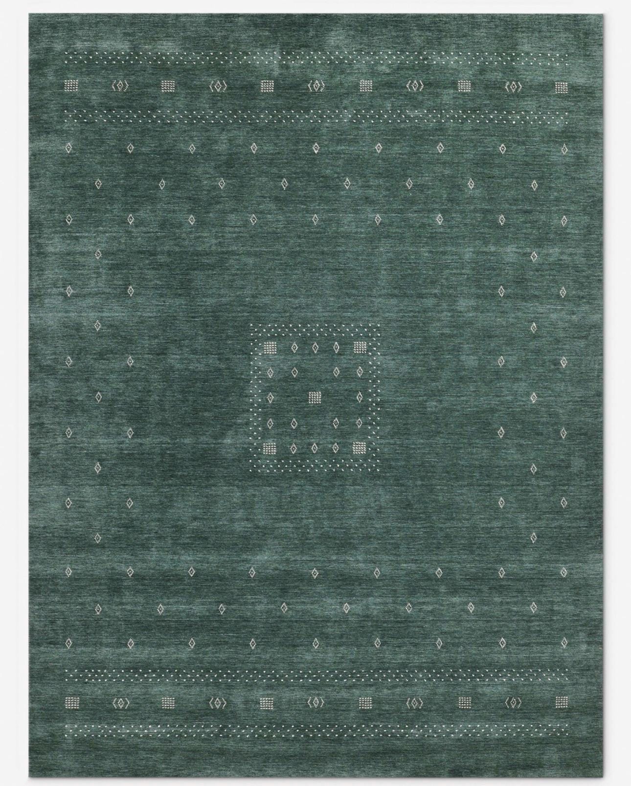 Hand loomed emerald green area rug.