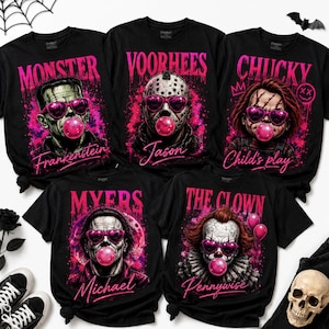 May include: Five black t-shirts featuring horror characters Frankenstein, Jason Voorhees, Chucky, Michael Myers, and Pennywise. Each character wears pink heart-shaped sunglasses and blows a pink bubblegum bubble against a pink splatter background.