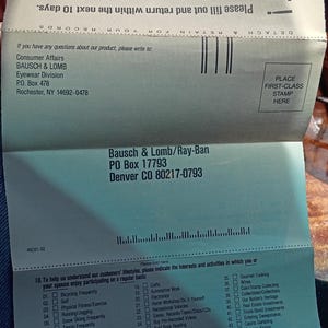May include: A folded Bausch & Lomb/Ray-Ban warranty and product registration card. The card includes a section for customer lifestyle interests and activities, and a place to affix a first-class stamp.