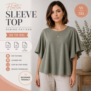 May include: A digital sewing pattern for a flutter sleeve top, featuring text indicating sizes XS to 5XL, PDF pattern, layered PDF, step-by-step guide, and instant download. The image displays a sage green top with wide sleeves and a round neckline.