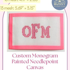 May include: A custom monogram painted needlepoint canvas with the letters "OFM" in pink. The canvas is white with a pink border. The image also shows the dimensions: 4.11" x 2.28" and 5.69" x 3.15". The Sunny Stitchery Studio logo is in the upper right corner.